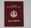 Maroon coloured booklet with gold lettering. 