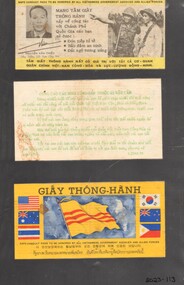 Three small coloured documents fixed onto a black cardboard in Vietnamese