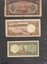 Three (3) paper notes. Image shows front ant back:  One 200dong, 100dong and a 20 dong