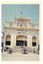 Buddhist pagoda. White ornate building with a flag pole flying the Vietnamese flag. 