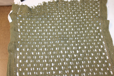Open weaved, khaki army issue sweat rag.