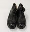 A pair of army issue black boots.