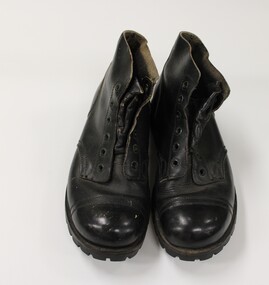 A pair of army issue black boots.