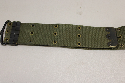 Khaki webbed belt with brass buckle, metal clamps and brass eyelets.