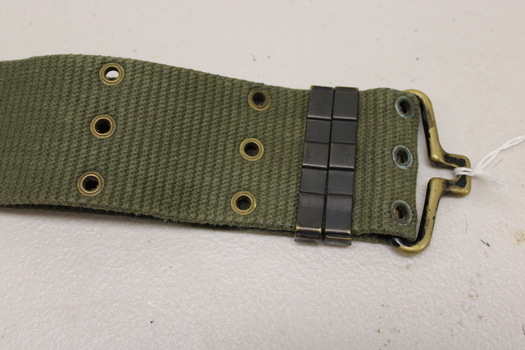 Khaki webbed belt with brass buckle, metal clamps and brass eyelets.