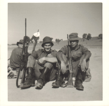 A Black and White Photograph of Three Soldiers with their Rifles