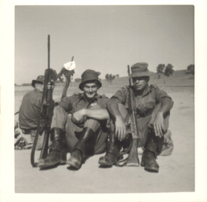 A Black and White Photograph of Three Soldiers with their Rifles