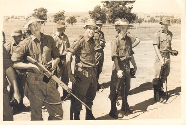 A Black and White Photograph of Several Soldiers on a Parade Ground