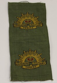 A khaki material patch of the Australian Military Force emblem.
