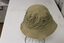 A green army issue hat called a "giggle hat" worn by Australia Army soldiers.