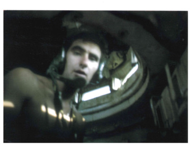 Image of Jeff McCole in a mine clearing tank.  