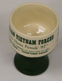Small ceramic drinking vessel.