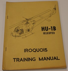 Cream coloured manual, staples down the left for HU-1B Iroquois.
