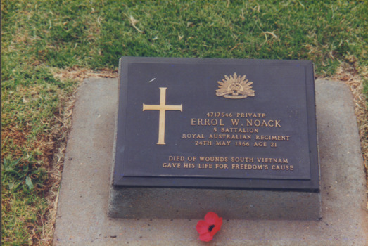 A Coloured Photograph of Errol W Noack Headstone with a Red Poppy