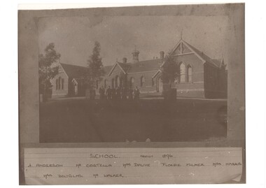 Seven staff members in front of Buninyong State School circa 1896