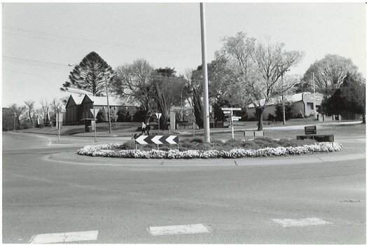 Roundabout at intersection of Learmonth and Warrenheip Streets Buninyong background RSL Hall and Memorial Gardens, Masonic Hall