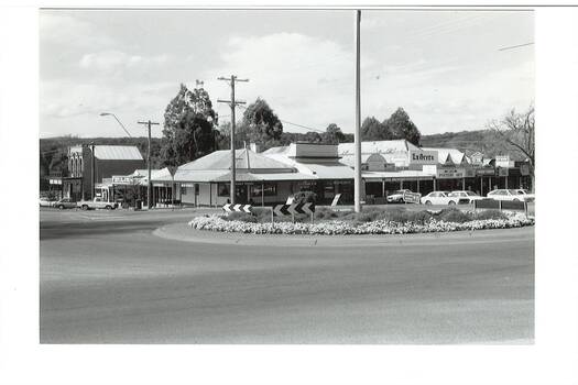 Buninyong roundabout, cnr Warrenheip and Learmonth Sts, with streetscape of shops on north-east corner
