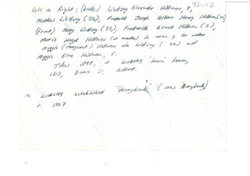 reverse of photo, handwritten identification of family in photo.