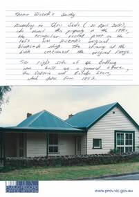 White weatherboard cottage dwelling, double fronted, new iron pitched roofs, stone fence, plain veranda.