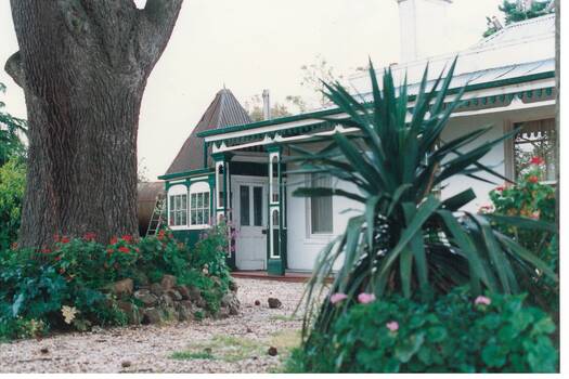 Victorian house, decorated veranday, cedar trunk, gazebo and glimpse of ship's boiler.