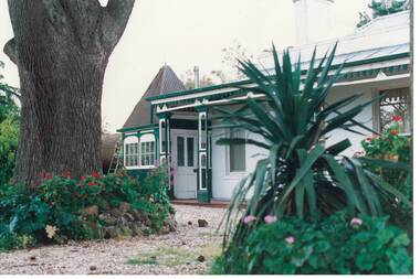 Victorian house, decorated veranday, cedar trunk, gazebo and glimpse of ship's boiler.
