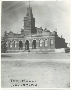 Town Hall Building, Italianate, polychrome brick, three open arches centre with clock tower above, wings either side, each with three arched windows