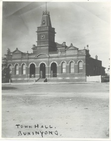 Town Hall Building, Italianate, polychrome brick, three open arches centre with clock tower above, wings either side, each with three arched windows