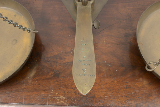 Stamped inscription on gold scales, central lever