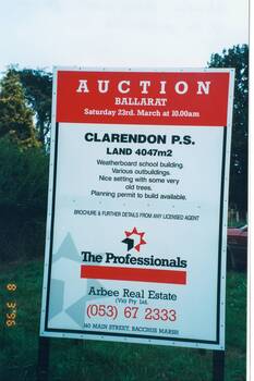 Image shows an auction sign for a wooden school building