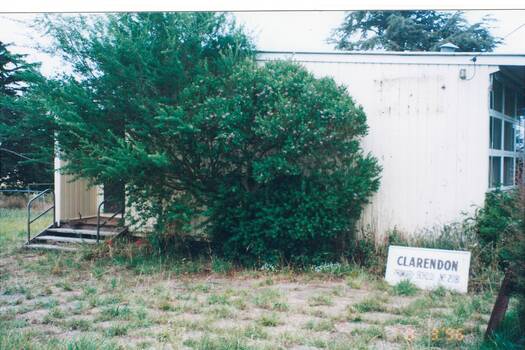 Image shows state of school building and condition of area.