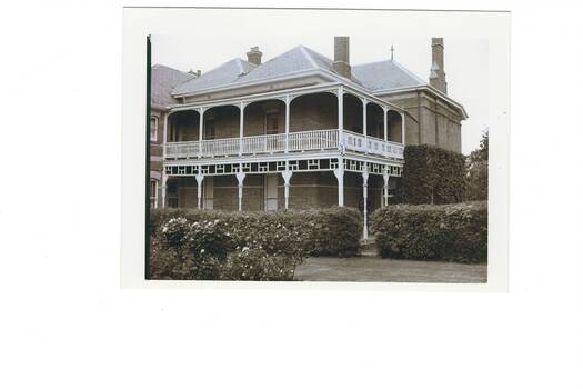 Good view of the front of the building showing many details of the building style and appearance