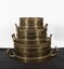 Stack of brass Imperial standard measures- Bushel, half-bushel, peck
