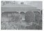 View of the front of the house showing the established garden and the lacework on the verandah