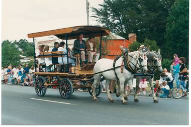 Festival procession passing through Buninyong with a Sovereign Hill coach and horses.