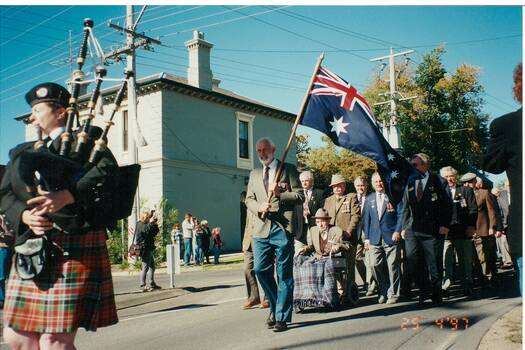 Anzac Day procession passing Crown Hotel in Buninyong.