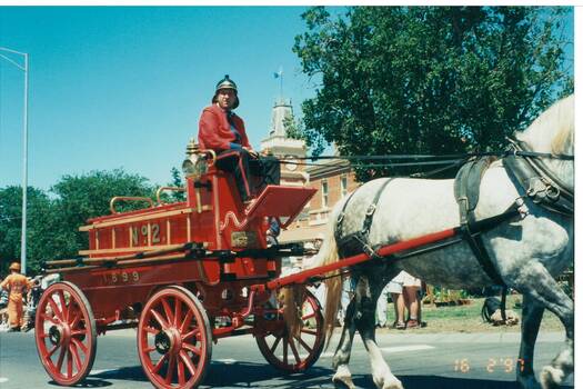 CFA "Merryweather" fire engine taking part in street procession for the Buninyong Festival 1997.