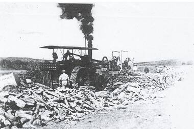 Photo of traction engine and stone crushing unit with crew