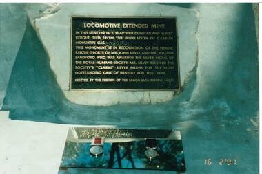Close up of the Locomotive Extended Mine Plaque and the medals awarded to John Silvey and William Sandford for their rescue attempt