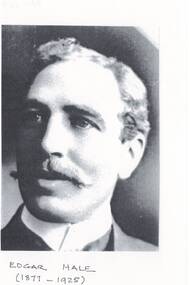 Facial portrait of middle-aged gentleman, receding hairline, fair or grey hair, wide moustache, wearing wing collar shirt.