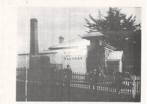 The weatherboard facade prominently displays the name of Buninyong Butter Factory and an unusual canopied chimney can be seen to the right.