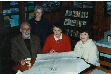 Derek Leather, Ann Gooding, Dawn Whykes and Karen Hulston examining an early map of Buninyong in the Buninyong Information Centre