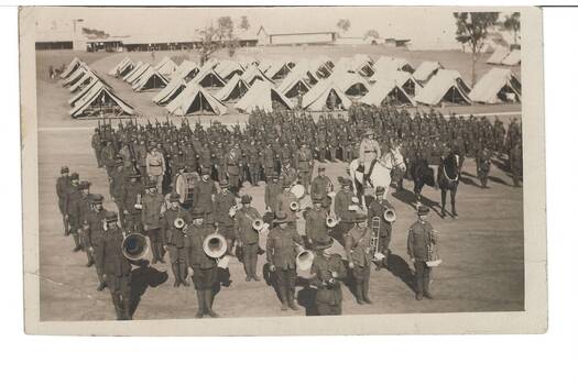 Black and White Postcard of Church Parade 7 & 8 Battalion Seymour 1927 Band members in foreground, mounted white Horse and black horse with white blaze right centre, troops at rear and tents visible in background.