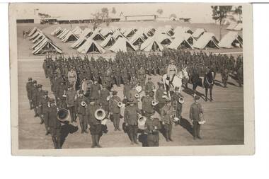 Black and White Postcard of Church Parade 7 & 8 Battalion Seymour 1927 Band members in foreground, mounted white Horse and black horse with white blaze right centre, troops at rear and tents visible in background.