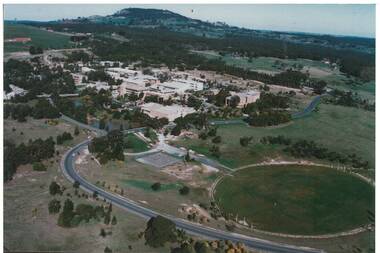 Aerial view from West of the buildings of Mt. Helen Campus c 1991 showing the oval in foreground and Mount Buninyong in the background