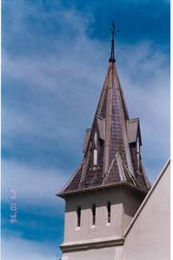 Colour close view of the decorative features of the top of the Buninyong Uniting Church spire and weather vane.