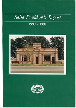 Cover of report, emerald green background, photo of old wooden library centre, tirle  in white letters, seal of Shire of Buninyong at bottom