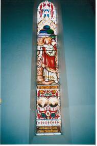Interior shot featuring the stained glass window dedicated to St. Matthew Chap. XIII and a loving memorial to Mr. and Mrs. Thomas Scott 