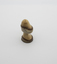 Sculptured walnut timber item with centre stem