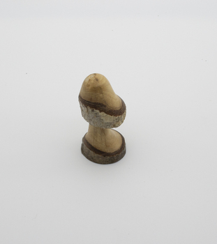 Sculptured walnut timber item with centre stem