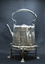 Silver hot water kettle with burner, left side